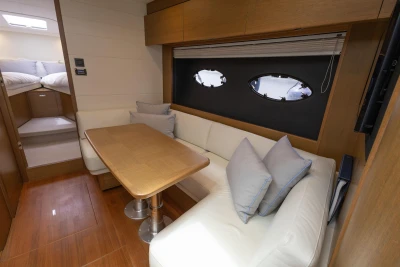 Luxurious interior of 2017 Princess V48 Open yacht with cozy seating and elegant dining area.