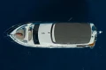 Aerial view of 2023 Princess F55 yacht on deep blue water.