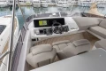 Luxurious 2023 Princess F55 yacht cockpit with modern navigation system and plush seating.