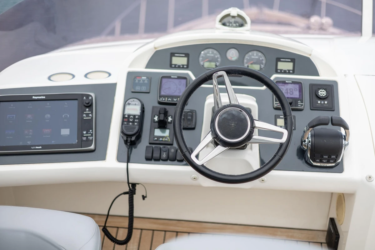 Steering console of a 2014 Princess 56 yacht with advanced navigation controls.