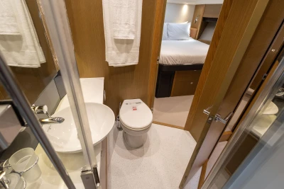Luxurious bathroom and bedroom interior on a 2014 Princess 56 yacht.