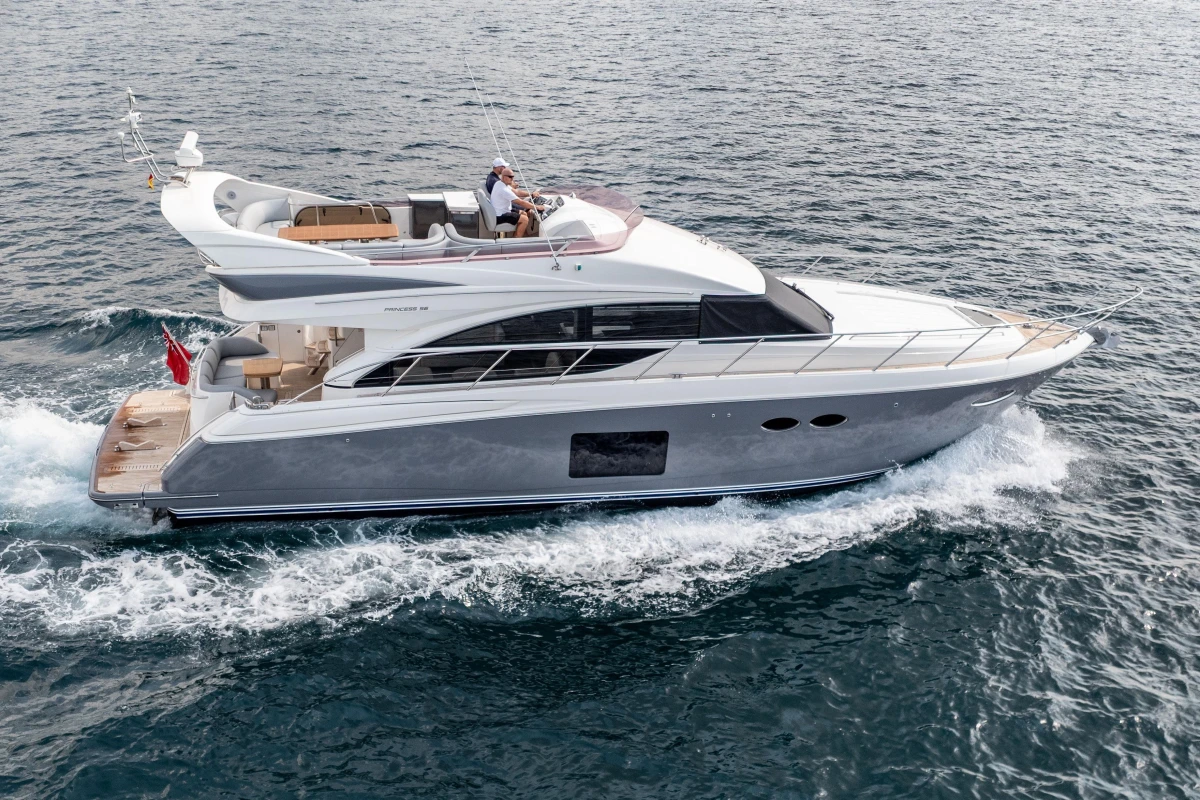 Luxury 2014 Princess 56 yacht cruising on open water.
