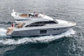 Luxury 2014 Princess 56 yacht cruising on open water.