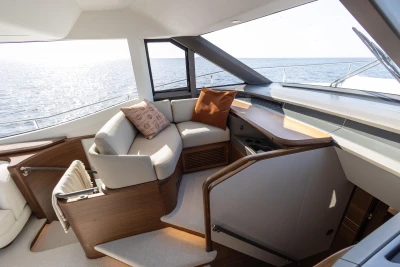 Luxurious interior of 2026 Princess Y72 yacht with elegant seating and ocean view.