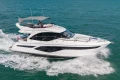 Luxury 2023 Princess F50 yacht cruising on open water.