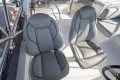 Luxury seating on 2023 Princess F50 yacht, featuring elegant gray upholstery and modern design.