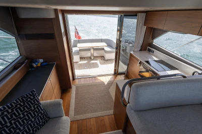 Luxurious interior of 2023 Princess F50 yacht with modern kitchen and ocean view.