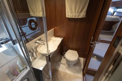 Luxurious bathroom in 2023 Princess F50 yacht with modern fixtures and wooden accents.