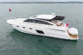 2014 Princess V52 yacht cruising on open water, side view.