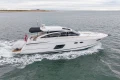 2014 Princess V52 yacht cruising on open water.