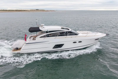 2014 Princess V52 yacht cruising on open water.