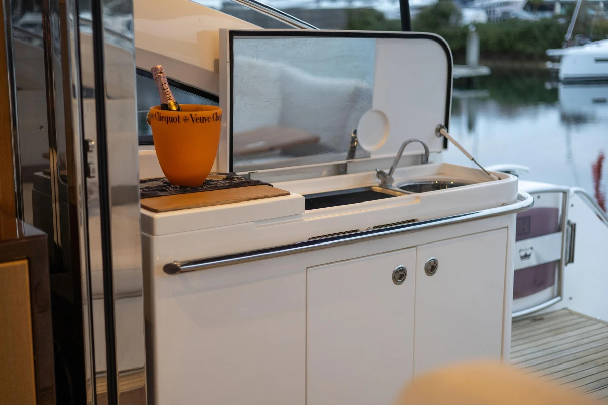 2014 Princess V52 yacht with outdoor sink and champagne bucket on deck.