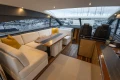 Luxurious 2014 Princess V52 yacht interior with elegant seating, modern design, and marina view.