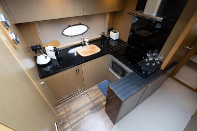 Luxurious 2014 Princess V52 yacht kitchen with modern appliances and sleek design.