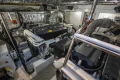 Engine room of a 2014 Princess V52 yacht, showcasing advanced machinery and equipment.