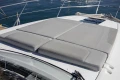 Sunbathing cushions on 2017 Princess V40 yacht deck, with ocean view.