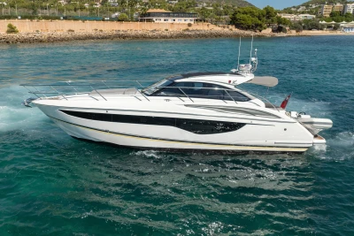 2017 Princess V40 yacht cruising on clear blue water.