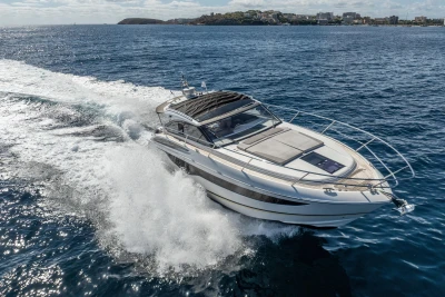 2017 Princess V40 yacht cruising on open water, creating a dynamic wake.