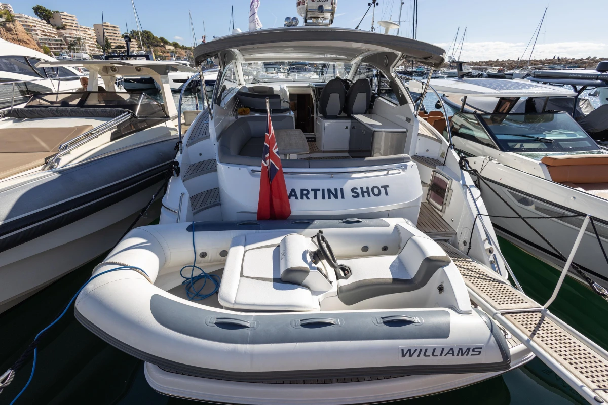 2017 Princess V40 yacht with inflatable boat, docked in a marina.