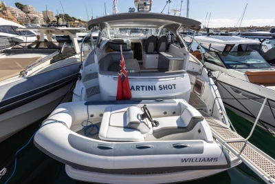 2017 Princess V40 yacht with inflatable boat, docked in a marina.