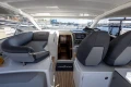 2017 Princess V40 yacht interior with helm, seating, and marina view.