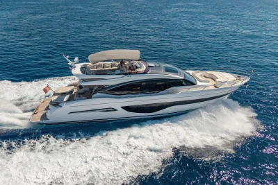 Luxurious 2022 Princess S78 yacht cruising on open sea, showcasing sleek design and elegance.