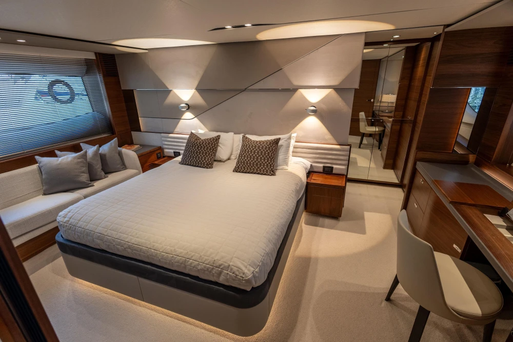 Luxurious 2022 Princess S78 yacht bedroom with modern design and elegant furnishings.