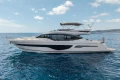 2022 Princess S78 yacht on open sea under clear blue sky.
