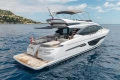 Luxurious 2022 Princess S78 yacht cruising on serene blue waters.
