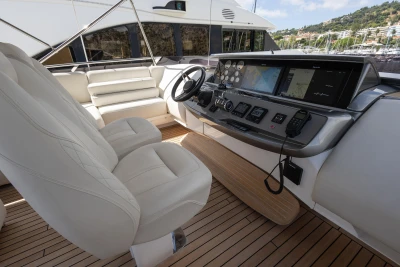 Luxurious 2022 Princess S78 yacht helm with modern navigation systems and plush seating.