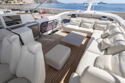 Luxurious 2022 Princess S78 yacht deck with plush seating and ocean view.