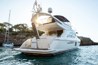 Luxurious 2008 Princess 58 yacht anchored in scenic coastal waters.