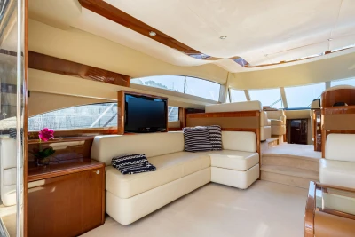 Luxurious interior of 2008 Princess 58 yacht with cream leather seating and modern decor.