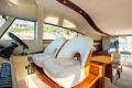 Interior of 2008 Princess 58 yacht with luxurious seating and panoramic windows.