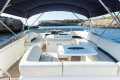 Luxurious 2008 Princess 58 yacht interior with elegant seating and scenic ocean view.