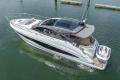 2023 Princess V50 yacht cruising on calm waters, showcasing sleek design and luxury features.