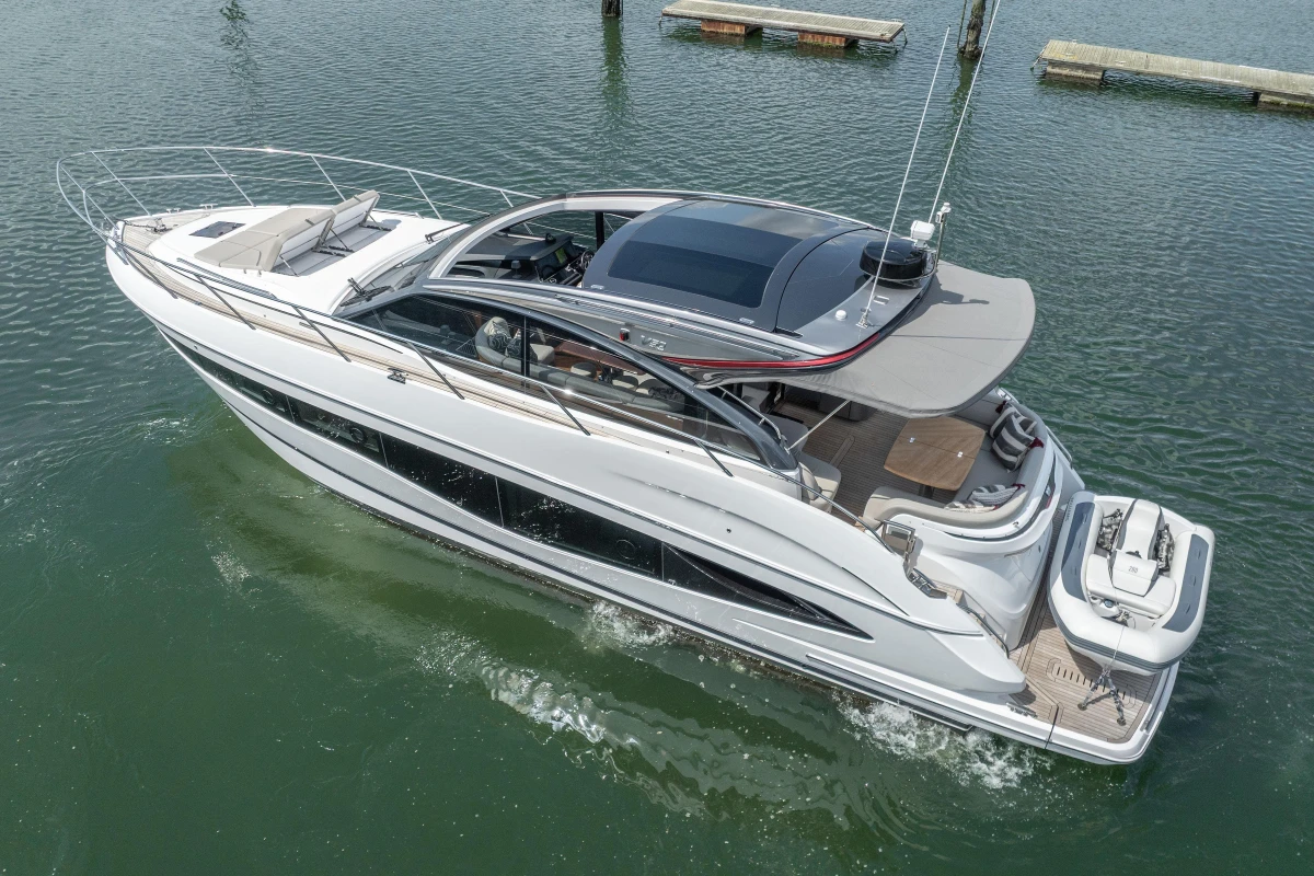 2023 Princess V50 yacht cruising on calm waters, showcasing sleek design and luxury features.