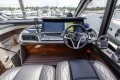 Cockpit of 2023 Princess V50 yacht with modern controls and leather seating.
