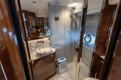 Luxurious bathroom in 2023 Princess V50 yacht with modern fixtures and elegant design.