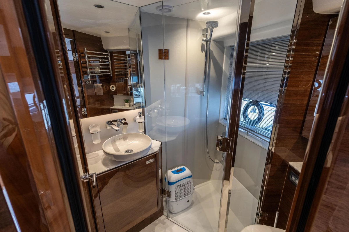 Luxurious bathroom in 2023 Princess V50 yacht with modern fixtures and elegant design.
