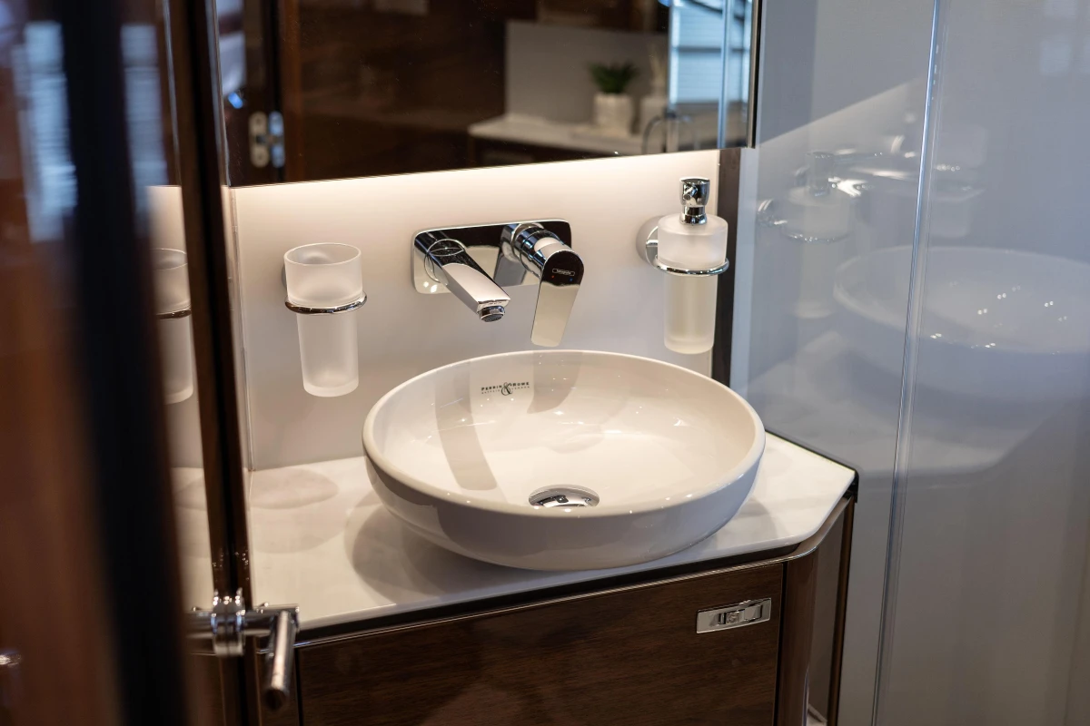 Modern bathroom sink in 2023 Princess V50 yacht, featuring sleek design and chrome fixtures.