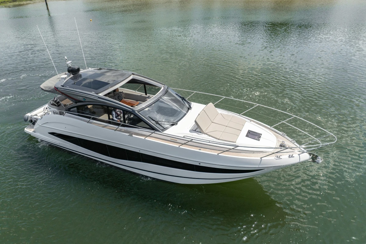 2023 Princess V50 yacht cruising on calm waters, showcasing sleek design and luxury features.