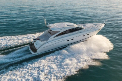 2006 Princess V53 yacht cruising on open water, creating a dynamic wake.