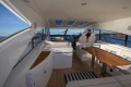 Luxurious 2006 Princess V53 yacht interior with elegant seating and wooden table.