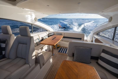 Luxurious interior of 2006 Princess V53 yacht cruising on open water.