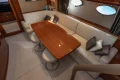 Luxurious interior of 2006 Princess V53 yacht with elegant dining area and plush seating.