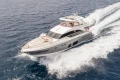 Luxurious 2015 Princess 68 yacht cruising on open sea, showcasing sleek design and elegance.
