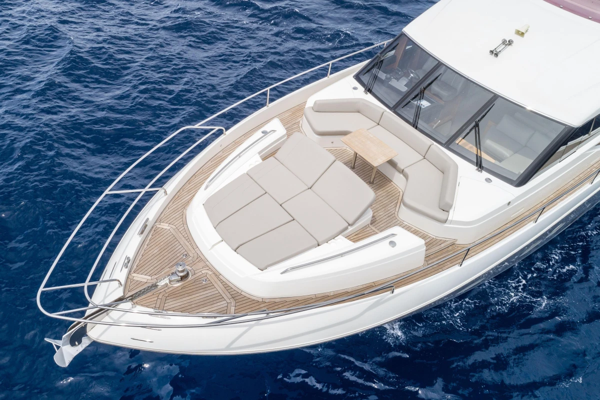 Luxurious 2015 Princess 68 yacht with spacious deck and seating on open sea.