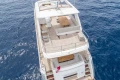 Aerial view of 2015 Princess 68 yacht on open sea, featuring spacious deck.