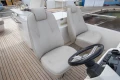 Luxury yacht helm with dual seats, Princess 68 model, 2015, featuring sleek design and controls.